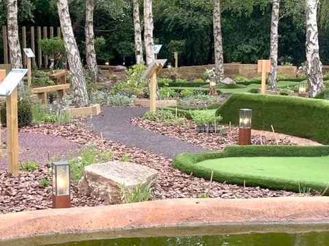 The landscaped adventure golf course with planting, statues and putting greens