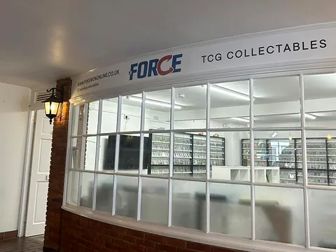 The Force TCG Collectables Pokémon card shop front in Fountains Mall, Odiham, with shelves of cards behind the windows