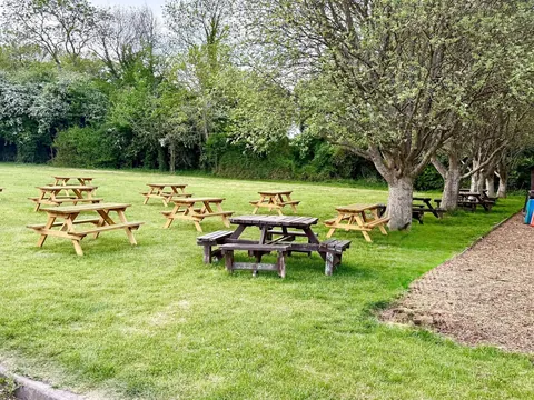 The Waterwitch's big lawned beer garden at Colt Hill, with picnic benches under the trees